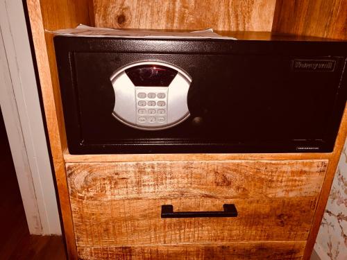 a toaster oven sitting on top of a wooden drawer at Garden Room or Economy Room in Amsterdam