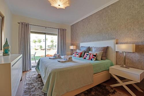 A bed or beds in a room at Albufeira Paradise with Pool by Homing