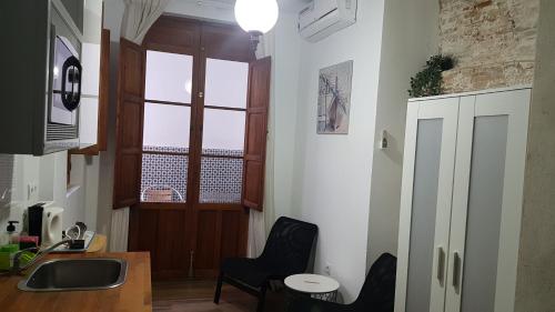Телевизор и/или развлекательный центр в PLAZA REDONDA brugada home