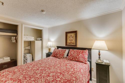 a bedroom with a bed and two red pillows at Stroll to Slopes, Village Area, Ski in-out MtLodge 345 in Snowshoe