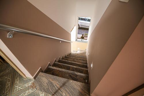 a staircase in a building with a window at Holiday Home with Hot tub and Sauna Sabina in Rovte