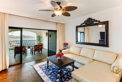 a living room with a couch and a table at Vista Encantada Resort & Spa Residences, A La Carte All Inclusive Optional in Cabo San Lucas