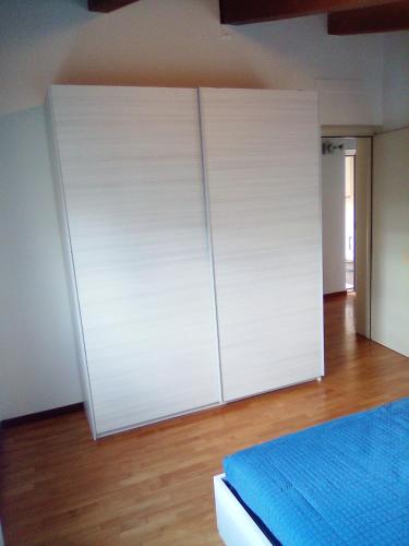 a white cabinet in a room with a bed at PESCARA HOME anto in Pescara