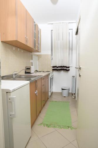 Kuchyň nebo kuchyňský kout v ubytování Zap apartman