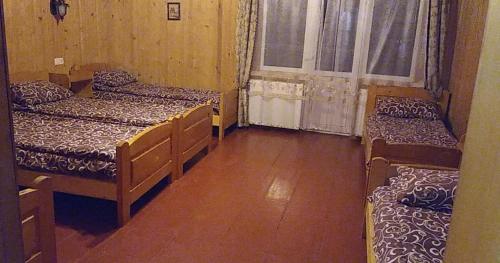 Postel nebo postele na pokoji v ubytování Дім з видом на гори.
