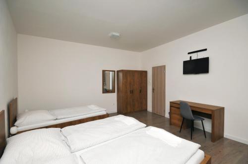 Posteľ alebo postele v izbe v ubytovaní Apartmány Mojžitov dvor