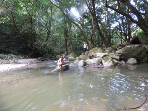a woman sitting on an elephant in the water at Hostal Alto de la Montaña in Minca