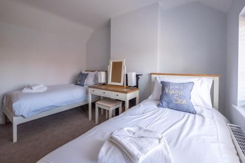 Ένα ή περισσότερα κρεβάτια σε δωμάτιο στο Pigwig Cottage, Thorpeness