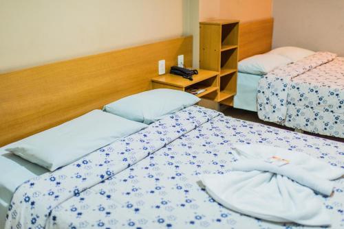 Un ou plusieurs lits dans un hébergement de l'établissement Solar Hotel