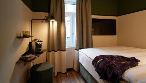 Ένα ή περισσότερα κρεβάτια σε δωμάτιο στο Boutique Hotel Josef