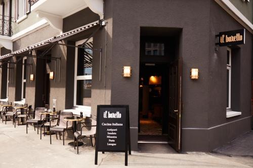 a restaurant with tables and chairs outside of a building at Boutique Hotel Josef in Zürich
