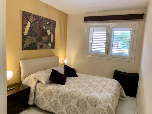 Postel nebo postele na pokoji v ubytování Apartamento Nuevo con Gran Terraza y Wifi en Canet