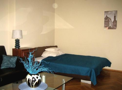 Posteľ alebo postele v izbe v ubytovaní Apartament Central