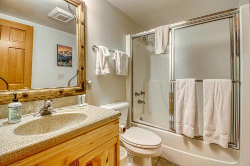 a bathroom with a toilet and a sink and a shower at Gray Wolf Condos at Whitefish in Whitefish