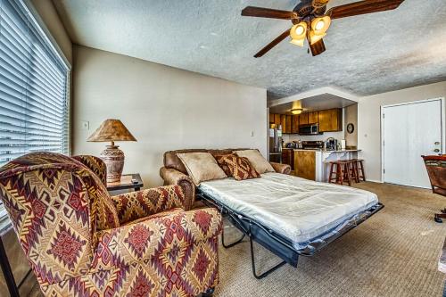 a living room with a bed and a couch at Brianwood Condos in Brian Head