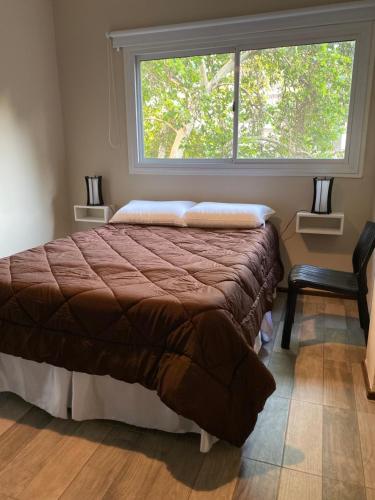Кровать или кровати в номере DEPARTAMENTO AURORA