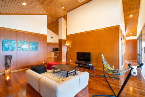 a living room with a couch and a table at HOLIDAY INN GARAKUTA in Ishigaki Island