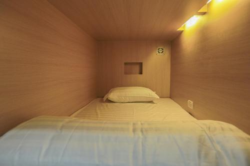 Un ou plusieurs lits dans un hébergement de l'établissement Petit Espace Boutique Hostel