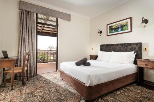 
A bed or beds in a room at The Esplanade Hotel Port Hedland

