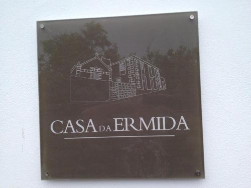 a sign for a casa erimimo building at Casa da Ermida in Velas