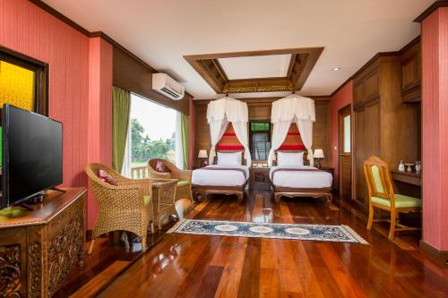 Katil atau katil-katil dalam bilik di Phusanfah Resort