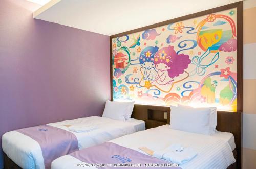 two beds in a room with a painting on the wall at HOTEL OKINAWA WITH SANRIO CHARACTERS in Naha