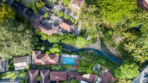 an overhead view of a house with a river at Ani's Villas in Ubud