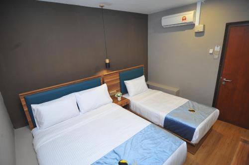 Ένα ή περισσότερα κρεβάτια σε δωμάτιο στο Skye Hotel Sunway