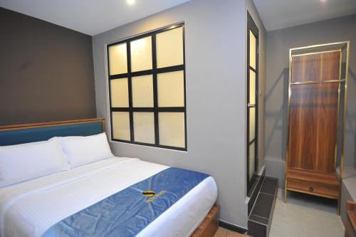 Ένα ή περισσότερα κρεβάτια σε δωμάτιο στο Skye Hotel Sunway