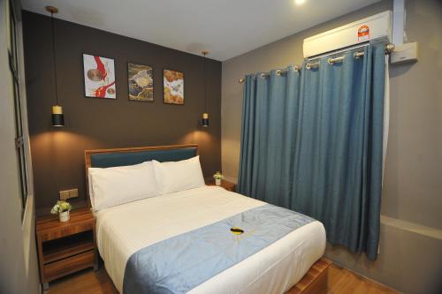 Ένα ή περισσότερα κρεβάτια σε δωμάτιο στο Skye Hotel Sunway