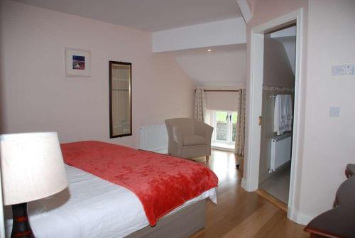 Postel nebo postele na pokoji v ubytování O'Briens Cashel Lodge