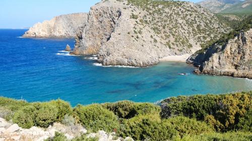 a view of a beach with rocks and water at B&B Del Viale in Bacu Abis