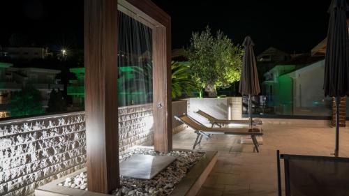 a view of a patio at night at Sun Village Aparthotel in Herceg-Novi