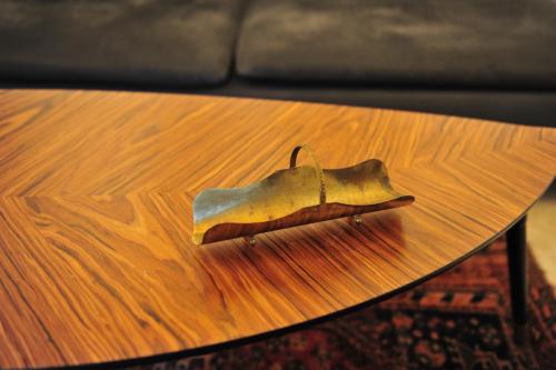 a shoe sitting on top of a wooden table at Casa Messi in Pitigliano