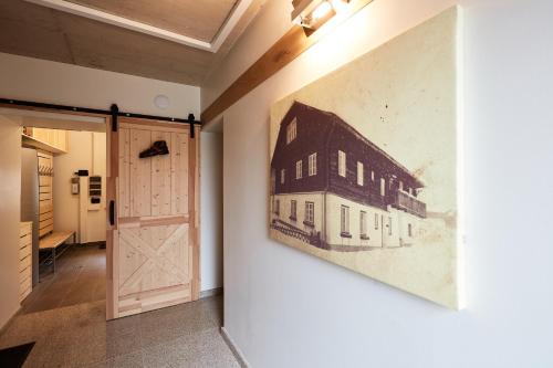 a painting of a building on a wall next to a door at HS - Rockhaus in Pruggern