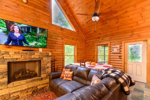 a living room with a couch and a fireplace at Smokies Overlook Lodge in Waynesville