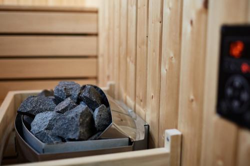a pile of rocks in a box in a sauna at HS - Rockhaus in Pruggern