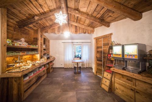 a large room with wooden ceilings and a star on the ceiling at Serendipity Hotel in Sauze dʼOulx