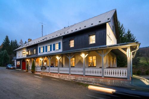 a building on the side of a street at MAXMILLIAN Pension & Restaurant in Mařenice