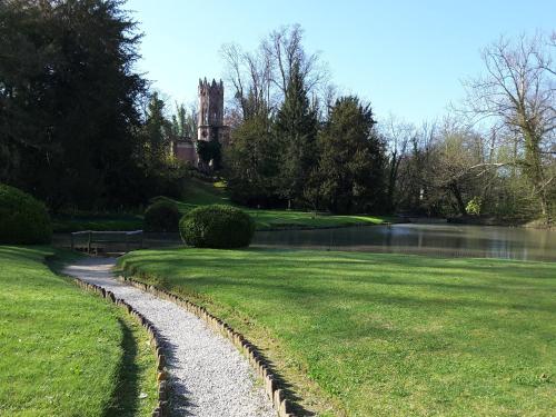 a stone path in front of a house and a pond at Hotel Riviera dei Dogi in Mira