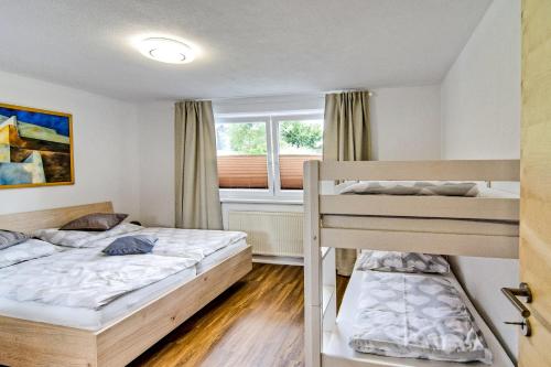 Postel nebo postele na pokoji v ubytování Ferienwohnung Ellmerer