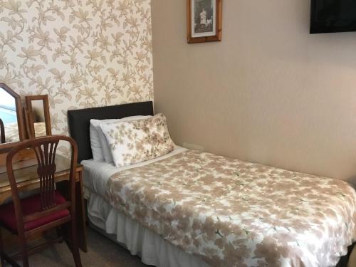 Ένα ή περισσότερα κρεβάτια σε δωμάτιο στο Bowman Lodge