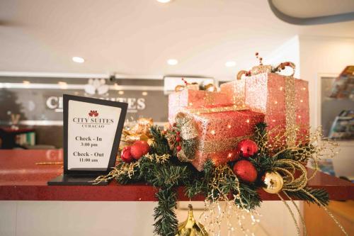 a display of christmas presents on a counter in a store at Majestic City Suites & Beach Hotel in Willemstad