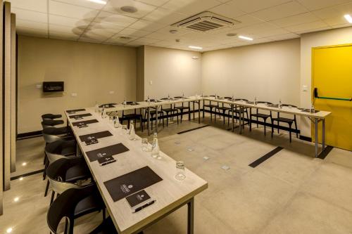 a large room with tables and chairs in it at Arawi Miraflores Express in Lima