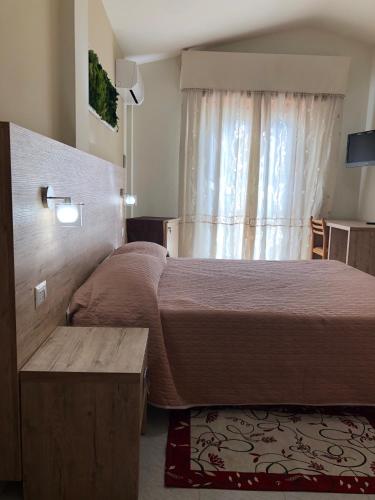 Ένα ή περισσότερα κρεβάτια σε δωμάτιο στο Hotel Centrale
