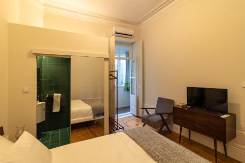 Una cama o camas en una habitación de aDuquesa - GuestHouse