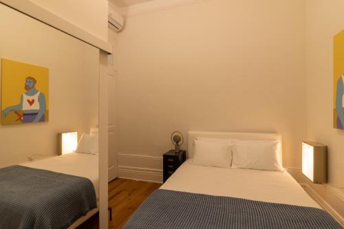 Una cama o camas en una habitación de aDuquesa - GuestHouse