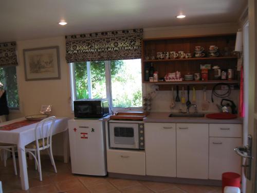 ครัวหรือมุมครัวของ Aimeo Cottage
