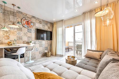 a living room with a couch and a table at Luxury apartment Orlando in Adeje