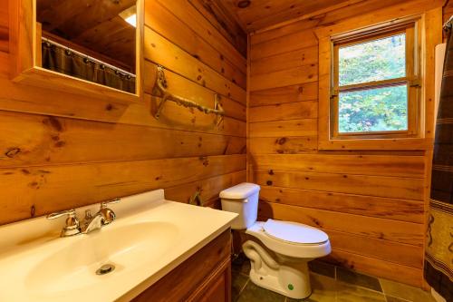 a bathroom with a toilet and a sink at Smokies Overlook Lodge in Waynesville